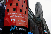 FILE PHOTO: The listing of Mobileye Global Inc., the self-driving unit of chip maker Intel Corp, is seen on a jumbotron outside the Nasdaq MarketSite at Times Square in New York City