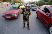 Afghans Taliban conduct checks on people and vehicles at checkpoints in Kabul