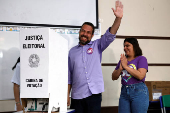 Sao Paulo mayor candidate leftist Guilherme Boulos gestures while voting at a polling station during the municipal elections in Sao Paulo