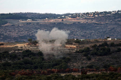 Smoke rises after rockets are fired from Lebanon towards Israel