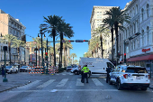 Police attend the scene where a pickup truck drove into a large crowd on Bourbon Street