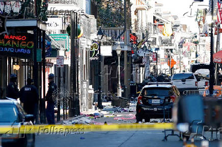 Debris is left along Bourbon Street after a pickup truck was driven into a large crowd in the French Quarter of New Orleans