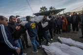 Palestinians mourn their dead at Deir Al Balah hospital after Israeli airstrike in central Gaza