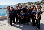 France's President Emmanuel Macron poses with foster children from Aide sociale a l'enfance (ASE) in Marseille