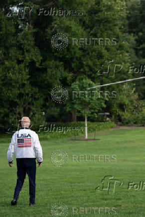 U.S. President Joe Biden wears the team USA Olympics jacket as he departs from the South Lawn of the White House