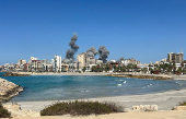 Smoke billows after an Israeli strike, amid the ongoing hostilities between Hezbollah and Israeli forces, in Tyre