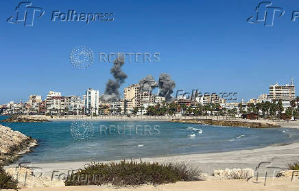 Smoke billows after an Israeli strike, amid the ongoing hostilities between Hezbollah and Israeli forces, in Tyre