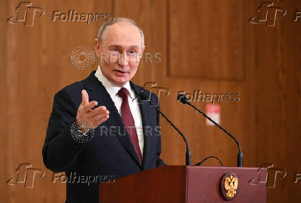 Russian President Putin attends a press conference in Astana