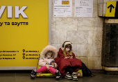 People take shelter inside a metro station during an air raid alert in Kyiv