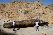 Apparent remains of a ballistic missile lie in the desert, following a massive missile and drone attack by Iran on Israel, near city of Arad