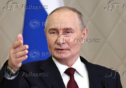 Russian President Putin attends a press conference in Astana