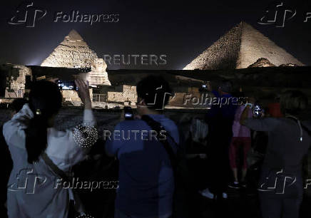 Giza Pyramids are lit up for World Tourism Day on the outskirts of Cairo