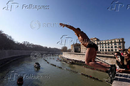 Traditional New Year's diving into the Tiber River in Rome