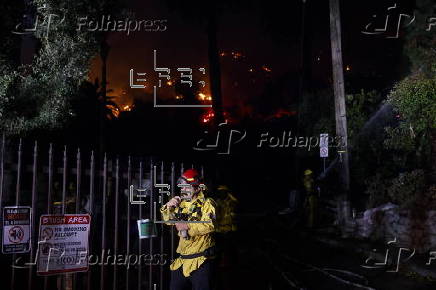 Firefighters battle the Hollywood Hills Fire in Los Angeles, California