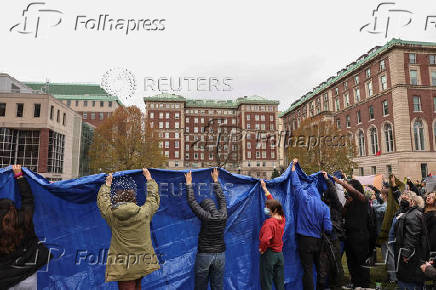 Demonstrators protest in solidarity with Pro-Palestinian organizers on the Columbia University campus, in New York