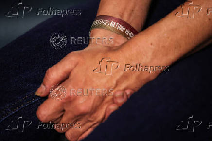 The hands of Einav Zangauker, mother of Israeli hostage Matan Zangauker who was seized by Hamas on October 7 and remains in Gaza, during an interview with Reuters in Tel Aviv