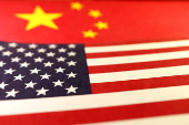 Illustration shows U.S. and Chinese flags