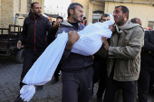 Palestinians mourn loved ones killed in Israeli strikes in Gaza