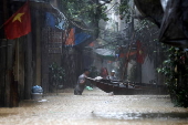 Red River overflows causing severe flooding in Hanoi following Typhoon Yagi