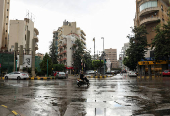 A man rides a motorbike at Sassine Square in Beirut