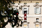 Pope Francis leads the Angelus prayer from his window, at the Vatican