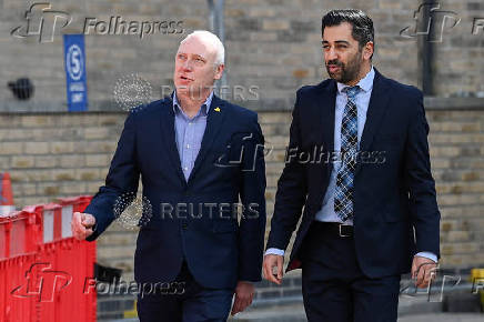 Scotland's First Minister Humza Yousaf visits a housing development in Dundee