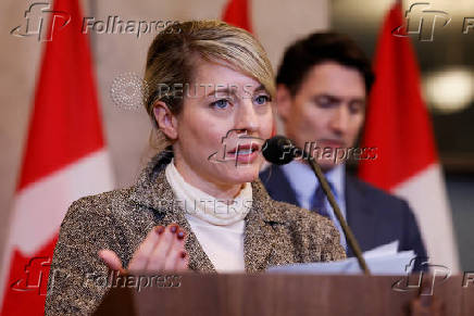 Canada's Canada's Minister of Foreign Affairs Melanie Joly and Prime Minister Justin Trudeau take part in a press conference on Parliament Hill in Ottawa