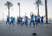 Women dance at the seafront in Beirut