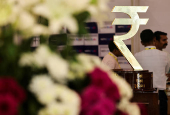 FILE PHOTO: The Indian Rupee logo is seen inside the Reserve Bank of India (RBI) headquarters in Mumbai