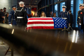 Mourners view the casket of former President Jimmy Carter as he lies in repose at the Jimmy Carter Presidential Library and Museum in Atlanta