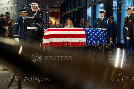 Mourners view the casket of former President Jimmy Carter as he lies in repose at the Jimmy Carter Presidential Library and Museum in Atlanta