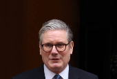 British Prime Minister Keir Starmer walks outside 10 Downing Street in London