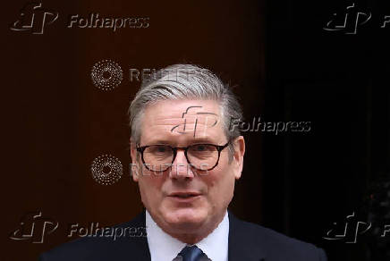 British Prime Minister Keir Starmer walks outside 10 Downing Street in London