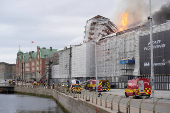 Emergency services work as fire burns at the Old Stock Exchange, Boersen, in Copenhagen