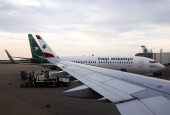 FILE PHOTO: A view from the window of a Lebanese Middle East Airlines (MEA) airplane shows an Iraqi Airways airplane docked after resuming flights to Lebanon