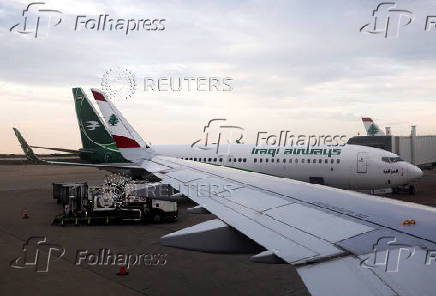 FILE PHOTO: A view from the window of a Lebanese Middle East Airlines (MEA) airplane shows an Iraqi Airways airplane docked after resuming flights to Lebanon