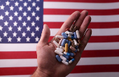 Illustration shows U.S. flag and medicines