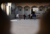 Students in a classroom after authorities announced the reopening of schools, in Damascus