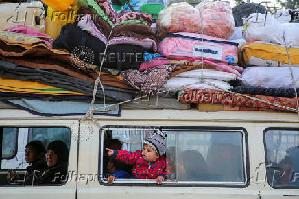 Displaced Palestinians wait to be allowed to return to their homes in northern Gaza, in the central Gaza Strip