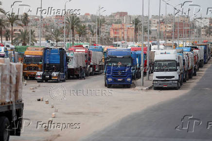 Trucks stand at the Rafah border crossing between Egypt and the Gaza Strip
