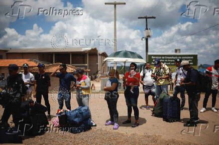 Venezuelans queue to get documentation after leaving Venezuela, at the border, in Pacaraima