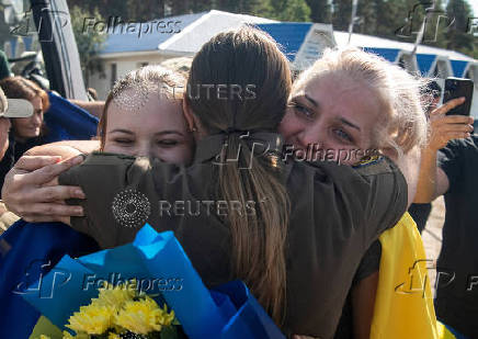 Ukrainian prisoners of war react after a swap, amid Russia's attack on Ukraine, at an unknown location in Ukraine