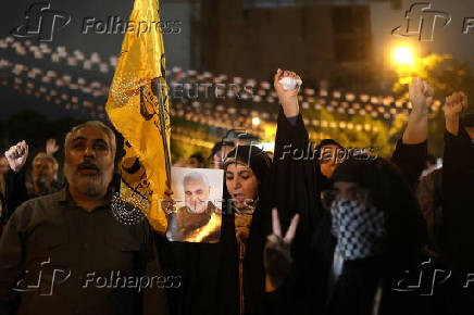 People protest following an Israeli strike on Lebanon, in Tehran