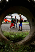 Migrants walk in a caravan in an attempt to reach the U.S. border, in Huixtla