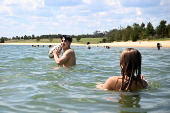 People find relief from the summer heat at Penrith Beach in Australia