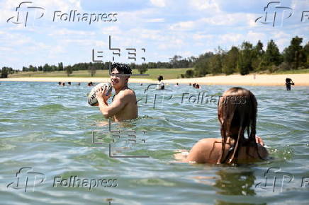 People find relief from the summer heat at Penrith Beach in Australia