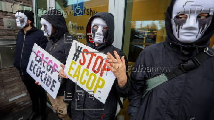 Extinction Rebellion activists in Brussels protest against East African Crude Oil Pipeline project