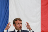 FILE PHOTO: French President Emmanuel Macron visits a factory of manufacturer Valeo, in Etaples