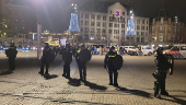 Policemen stand guard after youth clashed with Israeli football supporters, in Amsterdam