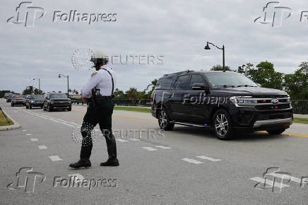 The motorcade carrying U.S. President-elect Trump departs Palm Beach